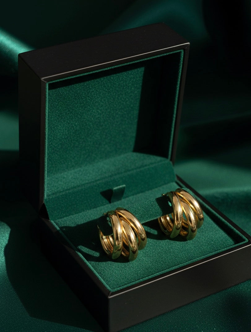 Steenless Steel , 14K Gold plating, Triple-hoop silhouette.